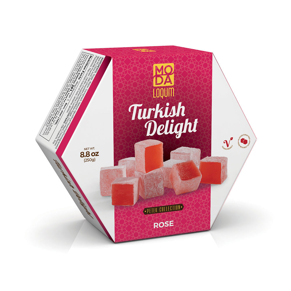 A hexagonal box of Moda Lokum Turkish Delight 'Rose' from the 'Saffro Collection' on a clean white background. The packaging features a vibrant pink and white design with illustrations of rose-colored Turkish delight cubes.