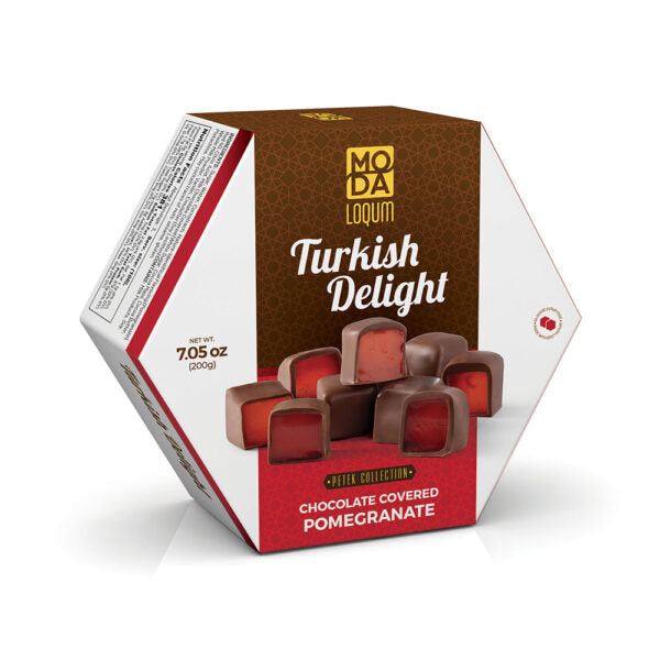 A hexagonal box of Moda Lokum Turkish Delight chocolate-covered pomegranate sweets, featuring a brown and white design with red accents and an image of the chocolate-covered sweets on the front.
