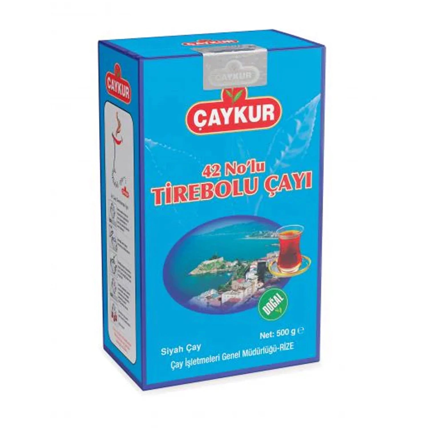 A 500 g box of Câykur 42 Noğlu Türebolu İşy, featuring a bright blue packaging design with red and white branding and a scenic illustration of a coastal town.