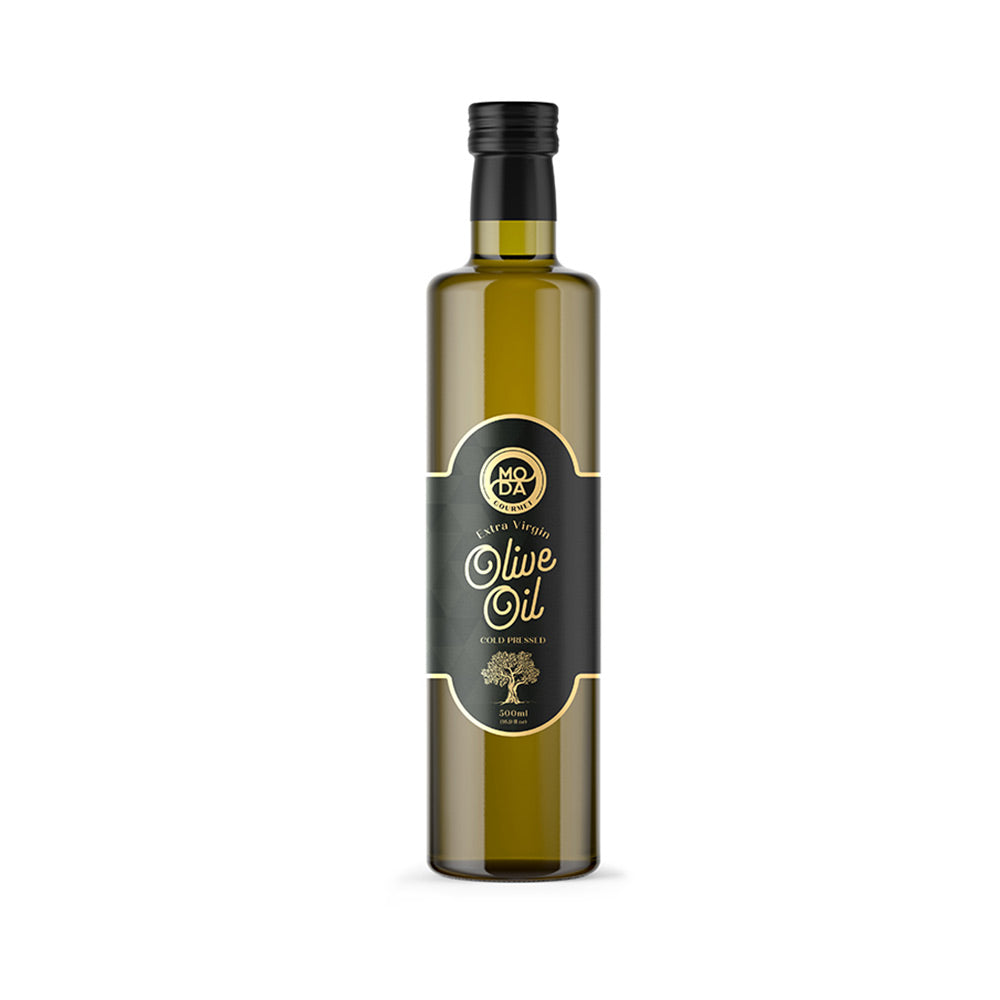 A tall, slender glass bottle of olive oil with a black cap and a black label featuring gold lettering and a gold tree emblem, set against a plain white background.