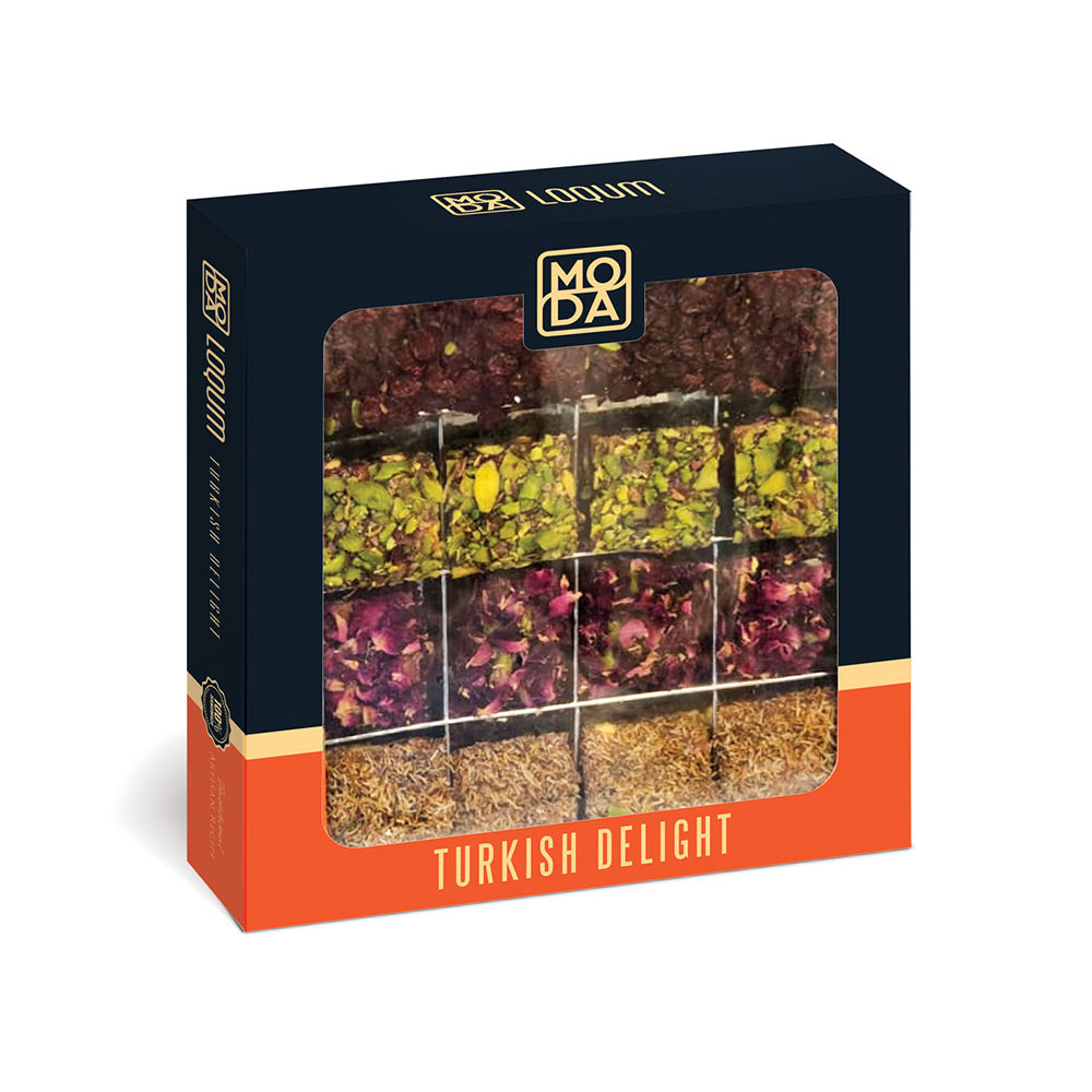 A boxed Turkish delight on a plain white background. The package is dark navy with an orange band at the bottom and a large clear window showing multiple tea blends arranged in a grid.