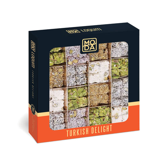 A boxed food product labeled '185 Logum' and 'Turkish Delight' by MODA, shown on a clean white background. The package is dark navy with an orange lower section and a window displaying multiple square slices of Turkish delight in green, beige, and white.