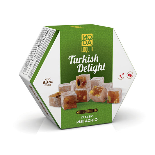 A hexagonal box of Moda Lokum Turkish Delight Classic Pistachio, featuring a green and white design with an image of pistachio-filled Turkish delight cubes on the front.