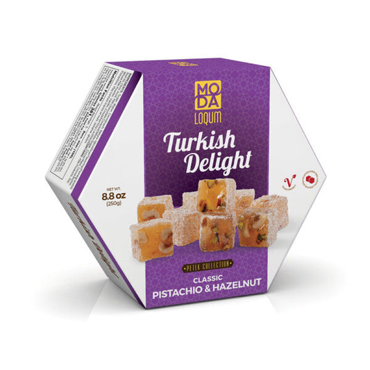 A hexagonal box of Moda Loqum Turkish Delight in Classic Pistachio & Hazelnut flavor, featuring a purple and white design with an image of the sliced Turkish delight pieces on the front.