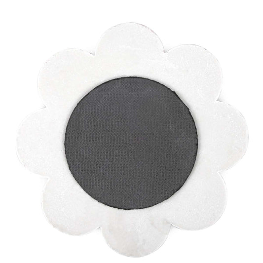 Back of flower-shaped Cappadocia trivet with dark circular backing